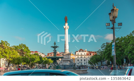 Timelapse hyperlapse of Rossio Square with wavy cobblestones, fountain and Pedro IV monument. Lisbon, Portugal 135863642