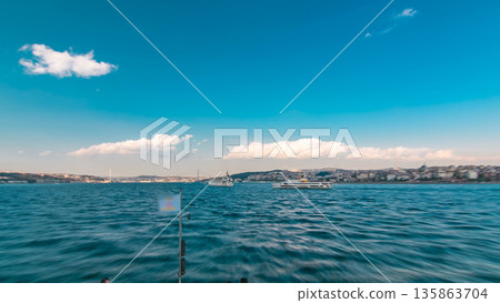 Ferry boat leaving from Galata Bridge at evening tome from european to asian part of Istanbul timelapse view from ship. Ferry boat leaving from Galata Bridge at evening tome from european to asian part of Istanbul timelapse view from ship. 135863704