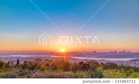 Colorful sunset on Bosphorus timelapse from Camlica hill with city skyline in Istanbul. Colorful sunset on Bosphorus timelapse from Camlica hill with city skyline in Istanbul. 135863711