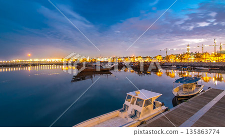 Fishing boat parked near the fish market next to Kuwait City Area day to night timelapse Fishing boat parked near the fish market next to Kuwait City Area day to night timelapse 135863774
