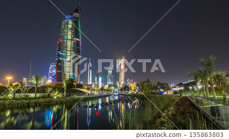 Music fountains in park with Kuwait City cityscape night timelapse hyperlapse 135863803