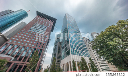 Hyperlapse looking up perspective at glass skyscrapers in Frankfurt's Innenstadt district. Germany Hyperlapse looking up perspective at glass skyscrapers in Frankfurt's Innenstadt district. Germany 135863812