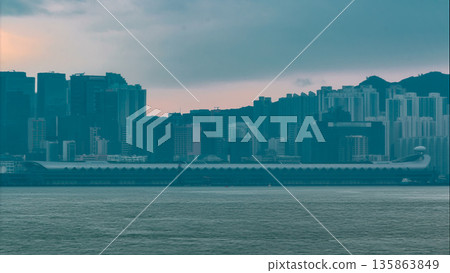 Hong Kong skyline in the morning over Victoria Harbour timelapse. Hong Kong skyline in the morning over Victoria Harbour timelapse. 135863849