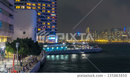 Avenue of Stars in Hong Kong at night timelapse. It honors celebrities of the Hong Kong film industry. Avenue of Stars in Hong Kong at night timelapse. It honors celebrities of the Hong Kong film industry. 135863850