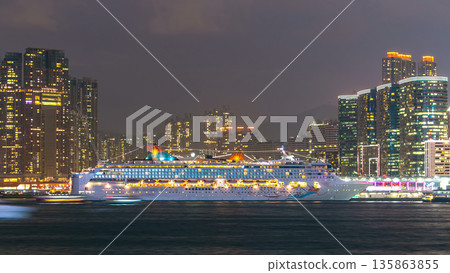 Skyline panorama timelapse day to night with towers and ship in West Kowloon, Hong Kong. Skyline panorama timelapse day to night with towers and ship in West Kowloon, Hong Kong. 135863855