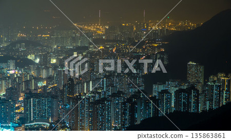 Fei ngo shan Kowloon Peak night timelapse Hong Kong cityscape skyline. Fei ngo shan Kowloon Peak night timelapse Hong Kong cityscape skyline. 135863861