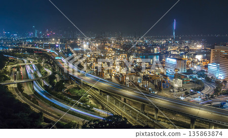 Hong Kong Skyline and Container Terminal in port at night timelapse Hong Kong Skyline and Container Terminal in port at night timelapse 135863874