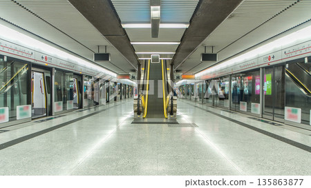 Subway train station interior timelapse in Central, Hong Kong. MTR is the most popular transport in Hong Kong 135863877