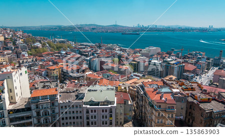 The view from Galata Tower to Golden Horn and Bosphorus, city skyline with red roofs timelapse, Istanbul, Turkey The view from Galata Tower to Golden Horn and Bosphorus, city skyline with red roofs timelapse, Istanbul, Turkey 135863903