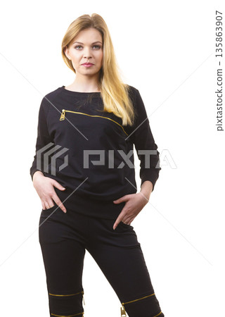 Woman wearing black top Woman wearing black top 135863907