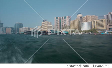 Excursion on traditional Abra boat at the creek in Dubai, UAE timelapse 135863962