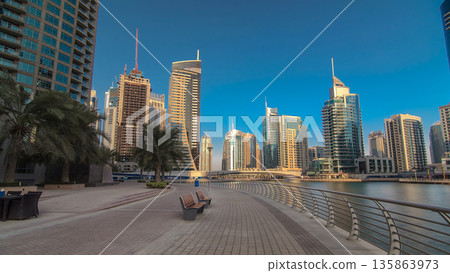 Dubai Marina with tallest skyscrapers and boats timelapse hyperlapse Dubai Marina with tallest skyscrapers and boats timelapse hyperlapse 135863973