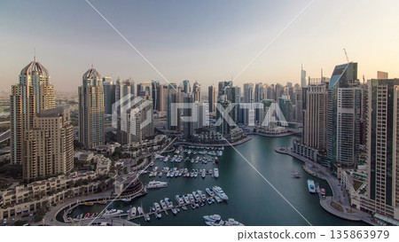 Modern buildings in Dubai Marina with shadows moving very fast timelapse, Dubai, UAE. Modern buildings in Dubai Marina with shadows moving very fast timelapse, Dubai, UAE. 135863979
