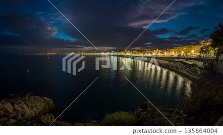 Waterfront of Nice city and Mediterranean Sea day to night timelapse 135864004