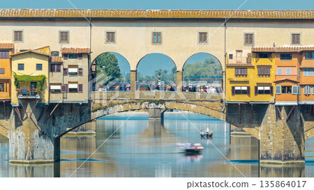The Ponte Vecchio on a sunny day timelapse, a medieval stone segmental arch bridge over the Arno River, in Florence, Italy The Ponte Vecchio on a sunny day timelapse, a medieval stone segmental arch bridge over the Arno River, in Florence, Italy 135864017