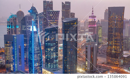 The skyline of the West Bay area from top in Doha day to night timelapse, Qatar. The skyline of the West Bay area from top in Doha day to night timelapse, Qatar. 135864091