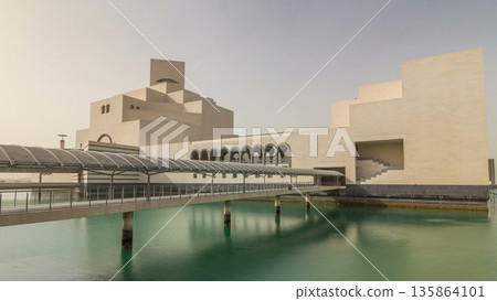 Qatar's museum of Islamic Art timelapse hyperlapse on its man-made island beside 135864101