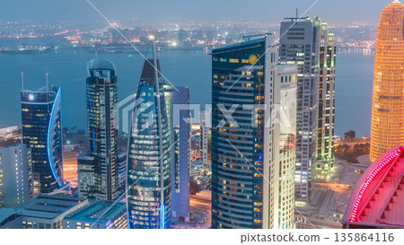 The skyline of the West Bay area from top in Doha day to night timelapse, Qatar. The skyline of the West Bay area from top in Doha day to night timelapse, Qatar. 135864116