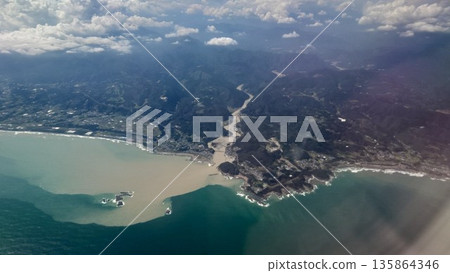 Aerial view of the flow of land from the mountains to the sea Aerial view of the flow of land from the mountains to the sea 135864346