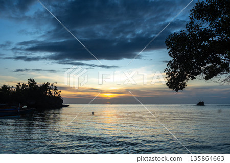 Sunset on Lia beach, Waleakodi Island, Togian archipelago, Sulawesi, Indonesia Sunset on Lia beach, Waleakodi Island, Togian archipelago, Sulawesi, Indonesia 135864663