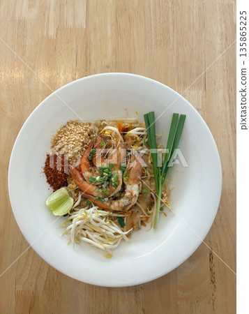 Authentic Thai Pad Thai Noodles with Fresh Shrimp, Peanuts, and Lime 135865225