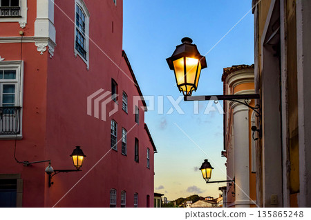 Houses illuminated by streetlights 135865248