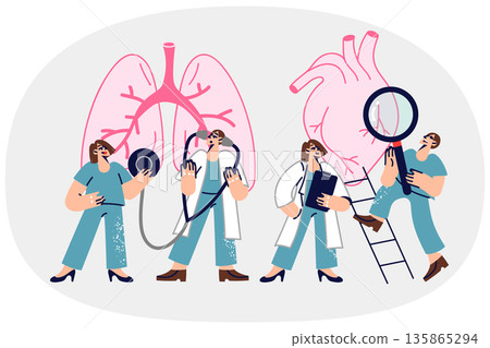 Consilium doctors examining patient giant heart and lungs to look for symptoms of disease Consilium doctors examining patient giant heart and lungs to look for symptoms of disease 135865294