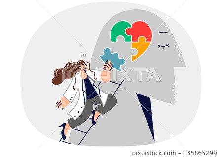 Woman psychotherapist helps restore psychological health of patient by assembling heart from puzzle Woman psychotherapist helps restore psychological health of patient by assembling heart from puzzle 135865299