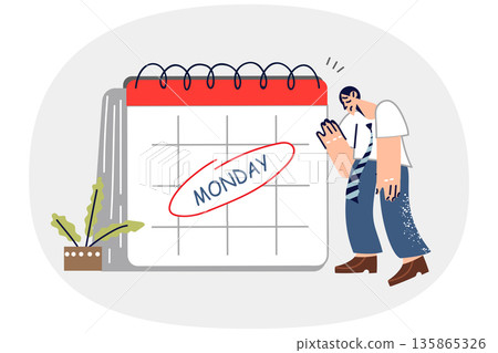 Exhausted man feels burnout on monday, stands near large calendar and does not want to go to work Exhausted man feels burnout on monday, stands near large calendar and does not want to go to work 135865326
