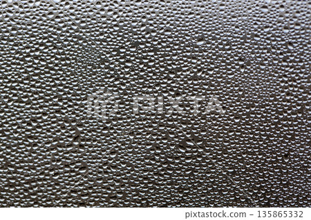 A background of a huge number of water droplets on glass A background of a huge number of water droplets on glass 135865332