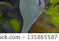Aerial View of a Winding River Through Iceland's Volcanic Terrain 135865587