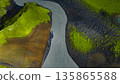 Aerial View of Winding River in Moss Covered Icelandic Landscape 135865588