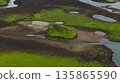 Aerial View of Moss Covered Hill and Volcanic Landscape in Iceland 135865590