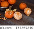 Fresh mandarins and peeled mandarins 135865840
