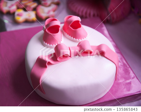 Beautiful children's pink cake for a newborn girl Beautiful children's pink cake for a newborn girl 135865843