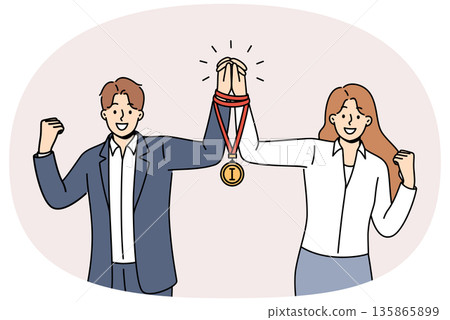 Team business man and woman together received winners medal for excellent work on assigned tasks Team business man and woman together received winners medal for excellent work on assigned tasks 135865899