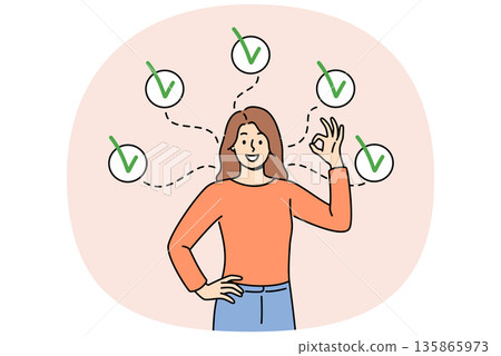 Woman shows ok gesture, reporting achievement of all assigned tasks, standing among checkmarks 135865973