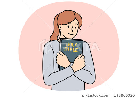 Believing woman embraces bible and feels enlightened after reading religious christian book Believing woman embraces bible and feels enlightened after reading religious christian book 135866020