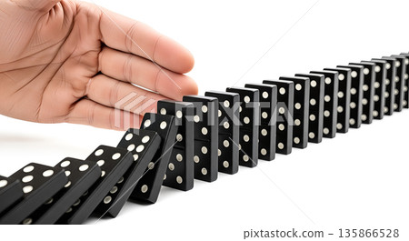 Businessman hand stopping falling dominoes chain reaction concept risk management crisis prevention business protection insurance strategy solution support safety stability 135866528