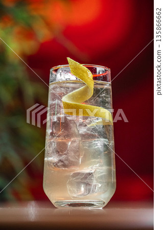 Clear cocktail with lemon twist and ice Clear cocktail with lemon twist and ice 135866662