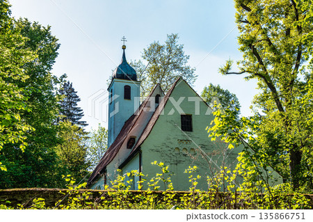 Church St.Clemens in Kranzberg near Freising, Bavaria with ancient graveyard and beautiful old wrought iron crosses Church St.Clemens in Kranzberg near Freising, Bavaria with ancient graveyard and beautiful old wrought iron crosses 135866751