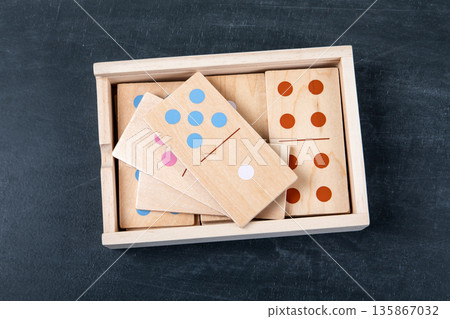 Wooden Domino Tiles Stored In Box On Dark Background 135867032