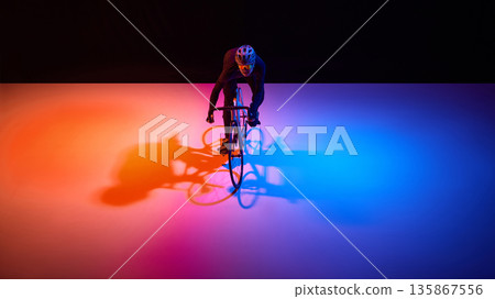 Professional cyclist maintaining focus during high intensity training ride. 135867556