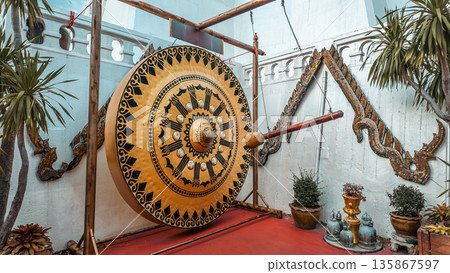 golden gong with mallet in Wat Saket Buddhist temple, Ritual Thai gong golden gong with mallet in Wat Saket Buddhist temple, Ritual Thai gong 135867597