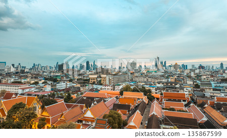 Panorama of Bangkok skyline from Wat Saket temple rooftop, Cityscape view with Thai temple roofs and urban horizon 135867599