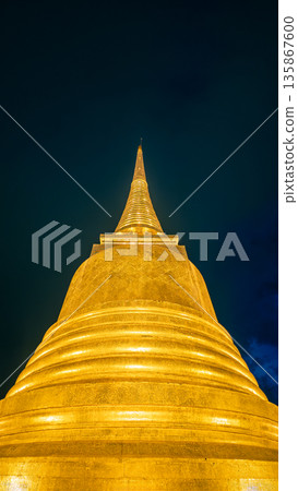 Golden mount Wat Saket illuminated at night Bangkok, Lit golden chedi stupa evening view, Thai temple dome, Bangkok Thailand Golden mount Wat Saket illuminated at night Bangkok, Lit golden chedi stupa evening view, Thai temple dome, Bangkok Thailand 135867600