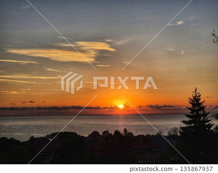 beautiful sunrise over the sea. sunset over the sea beautiful sunrise over the sea. sunset over the sea 135867937