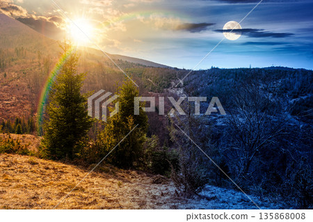 mountains in early spring. day and night time change concept. tree stumps on rolling hills with sun and moon. forest clearing. deforestation landscape under blue sky. duality and transition template 135868008