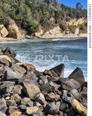 mesmerizing landscape. Mountain landscape with large stones on the seashore. mesmerizing landscape. Mountain landscape with large stones on the seashore. 135868031