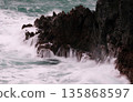 Slow shutter of rough waves crashing against the rocks 135868597